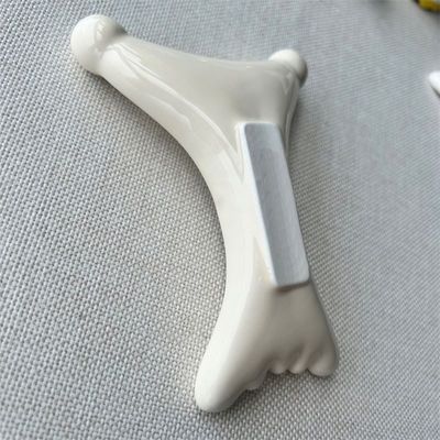 OEM/ODM X σχήμα κεραμικής Gua Sha ξύρισμα μασάζ σαλόνι ομορφιάς απαραίτητο για χαλάρωση του προσώπου